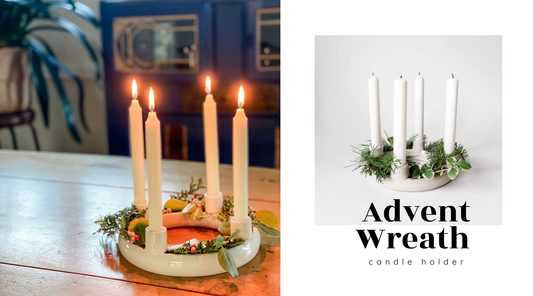 Handmade Porcelain Advent Wreath styled with 4 white candles and green foliage