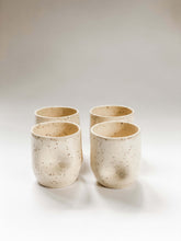 Load image into Gallery viewer, Four wheel thrown tumbler in cream clay with speckles with two dimples pinched into the sides