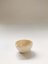Load image into Gallery viewer, A small wheel thrown bowl with a pouring spout in cream clay with speckles