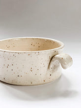 Load image into Gallery viewer, Close up of handle on wheel thrown cylindrical soup bowls with two hooked handles in a cream and brown speckled clay