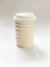 Load image into Gallery viewer, Wheel thrown travel mug in cream and brown speckled clay with hand painted subtle matte curving line design