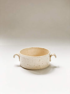 Wheel thrown cylindrical soup bowls with two hooked handles in a cream and brown speckled clay