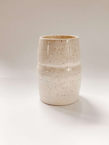 Tall, two sectioned wheel thrown vase in cream and brown speckled clay
