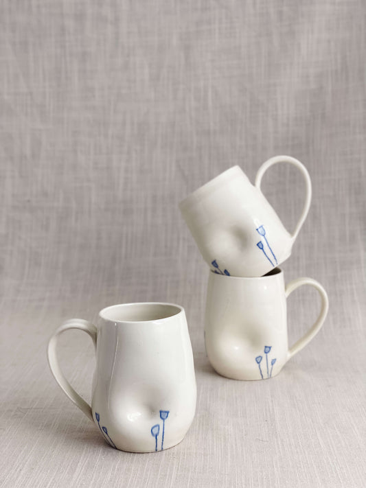 Indented Blue Tulip Mugs in White Porcelain