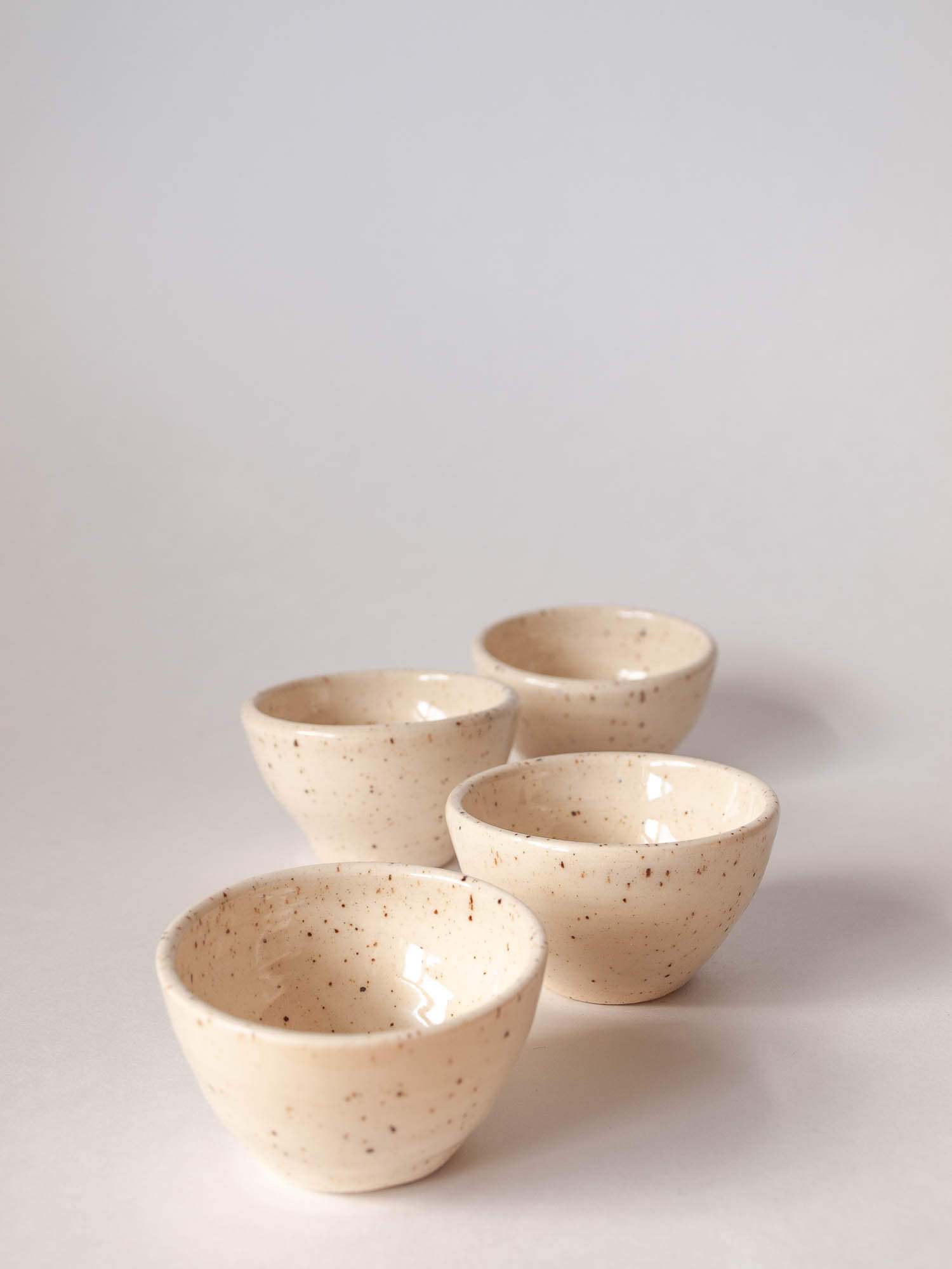 Small wheel thrown ramekins (4) in cream with brown speckled clay 